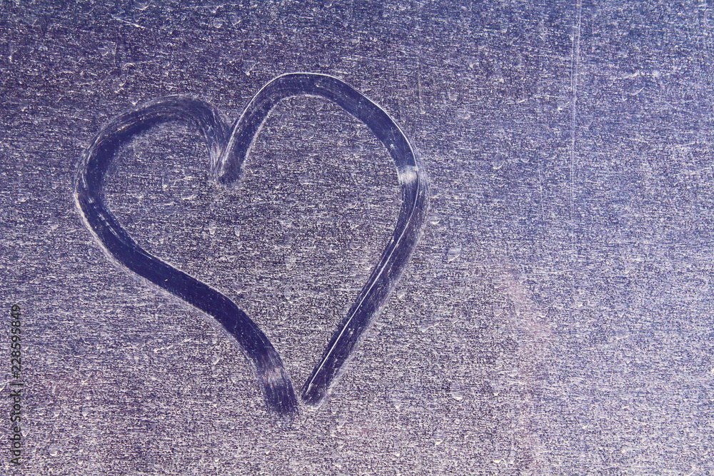 Heart painted on a dirty sheet of iron. Close-up. Background. Texture. Heart painted on a dirty sheet of iron. Close-up. Background. Texture.