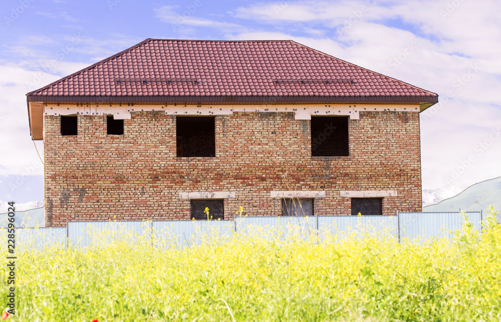 unfinished two-storey brick house in the nature unfinished two-storey brick house in the nature