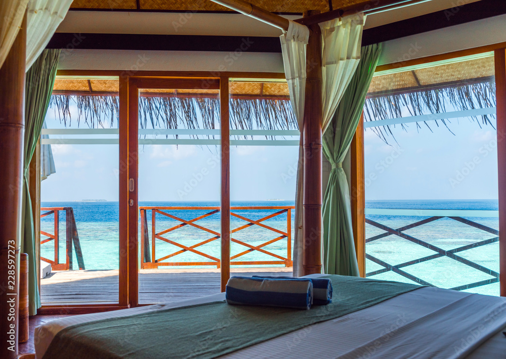 Fototapeta premium Stylish room with an ocean view, Maldives. With selective focus.