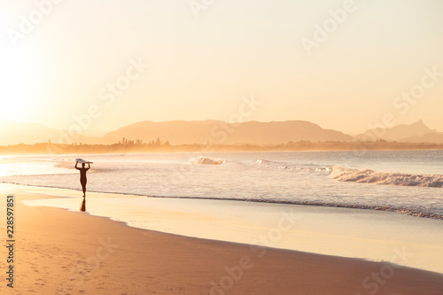 Sunset surfer in Byron Bay