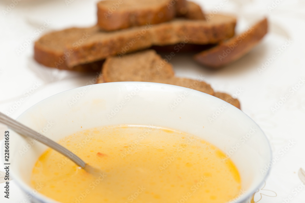 Soup with meatballs in a white bowl on the wooden background. Soup with meatballs in a white bowl on the wooden background.