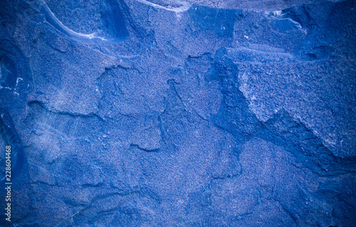 blue granite stone tiled background with vignette. geological, texture.