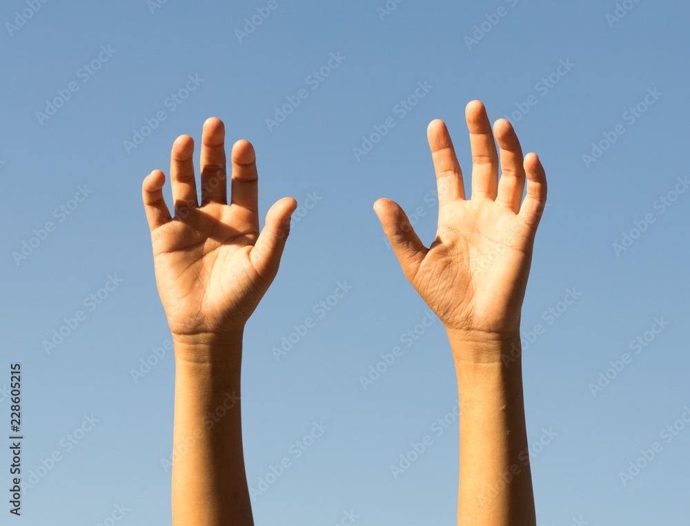 children's hands close-up against the sky children's hands close-up against the sky
