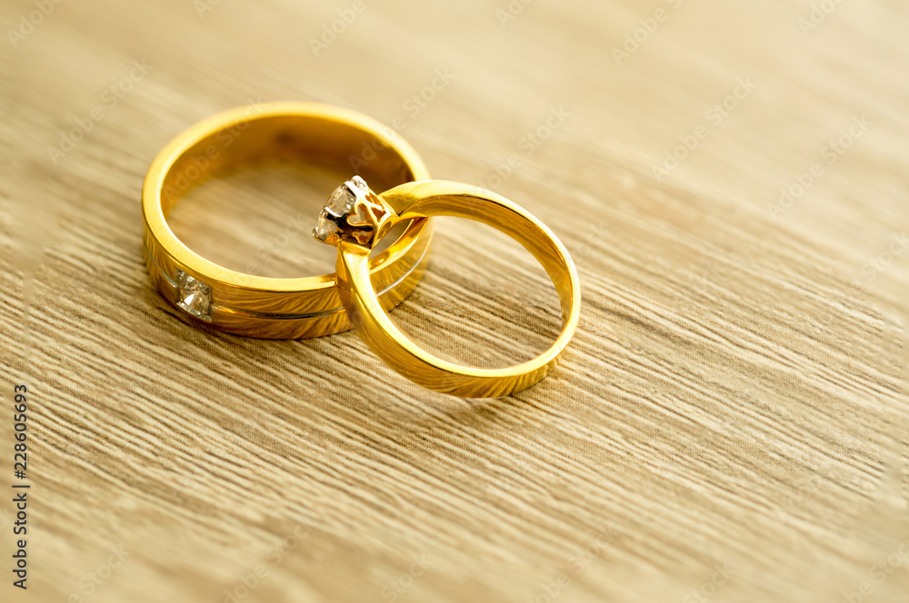 Diamond ring, wedding ring, Wedding Ring bride price. Wedding symbols. Wedding ceremony. image for objects and article.rings on wooden surface, symbol of couple Diamond ring, wedding ring, Wedding Ring bride price. Wedding symbols. Wedding ceremony. image for objects and article.rings on wooden surface, symbol of couple