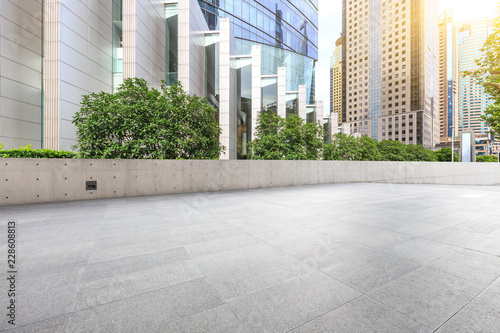 Empty square floor and modern city commercial building scenery © ABCDstock