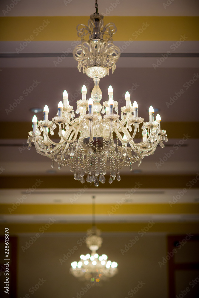 lighting lamp hanging on ceiling of ballroom dance in wedding ceremony date. Retro and vintage style.