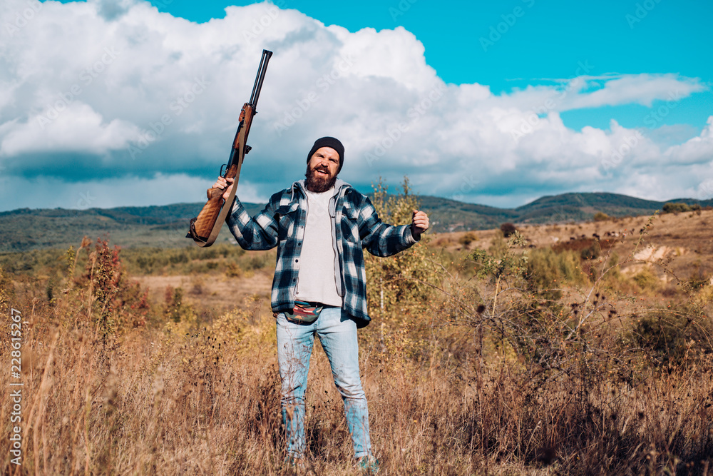 American hunting rifles. Hunting without borders. Hunter with shotgun gun on hunt. Mountain hunting. American hunting rifles. Hunting without borders. Hunter with shotgun gun on hunt. Mountain hunting.