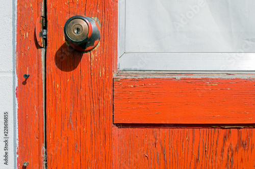 Door With Peeling Paint and Doorknob