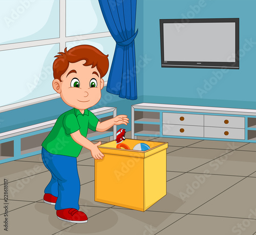 Boy Toddler Picking Up His Toy to Store in the Container