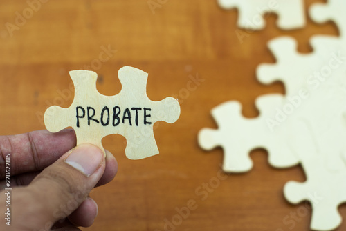 Unknown hand hold wooden puzzle with text probate