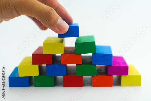 Arrangement of colorful wooden block on white background