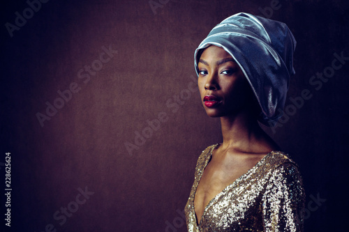 Woman wearing turban and sequin dress
