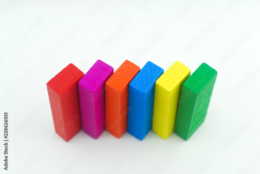 Obraz premium Arrangement of colorful wooden block on white background