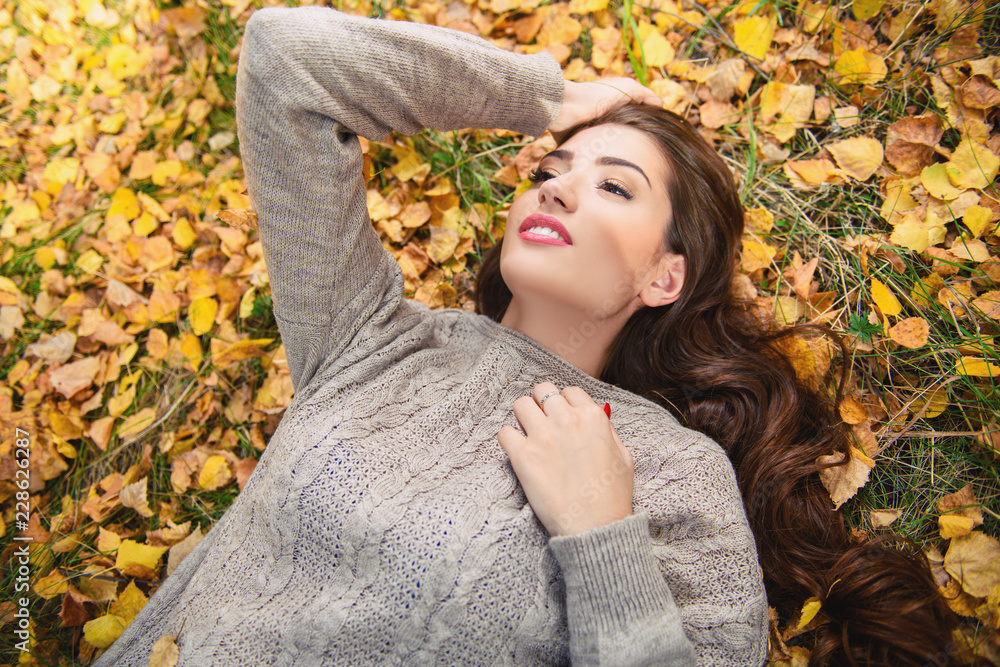 lying on golden leaves lying on golden leaves