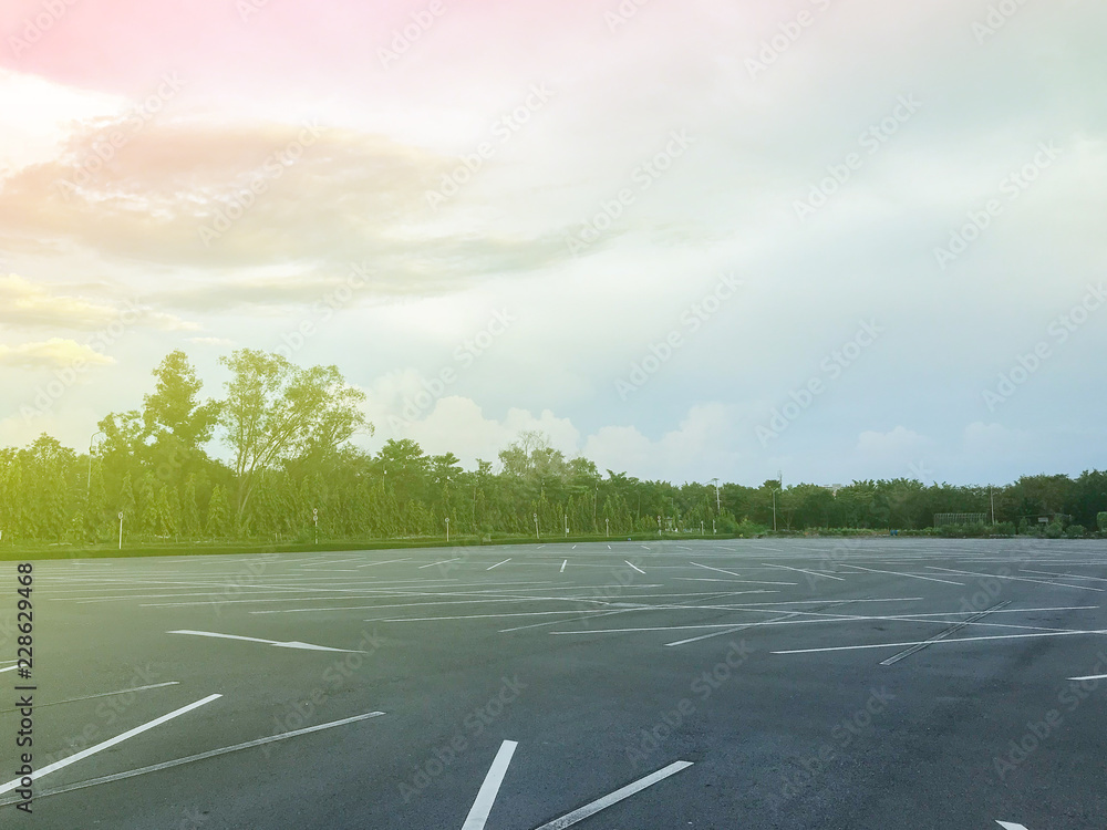 Fototapeta premium empty outdoor car parking lot at evening