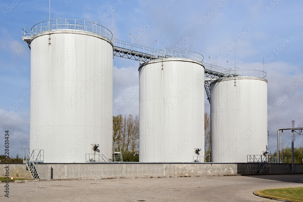 Exterior of oil storage tanks on the agricultural plant. Exterior of oil storage tanks on the agricultural plant.
