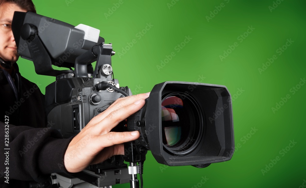 Cameraman with his camera on white background
