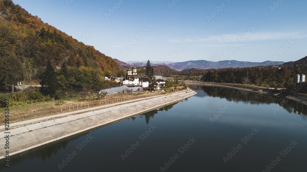 Cornet Monastery on Olt Valley River on a sunny day. Cornet Monastery on Olt Valley River on a sunny day.