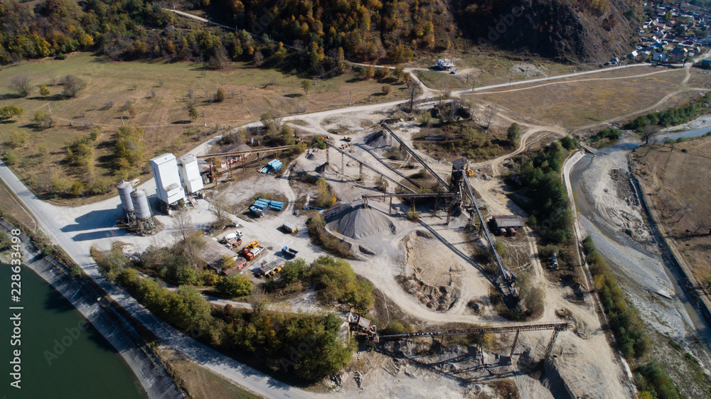 Aerial view of a busy gravel pit extraction site. Aerial view of a busy gravel pit extraction site.