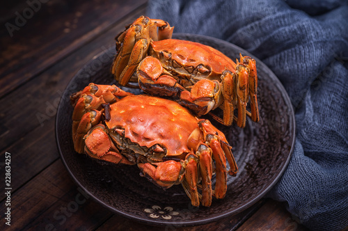 Photography Two cooked hairy crabs on the table.