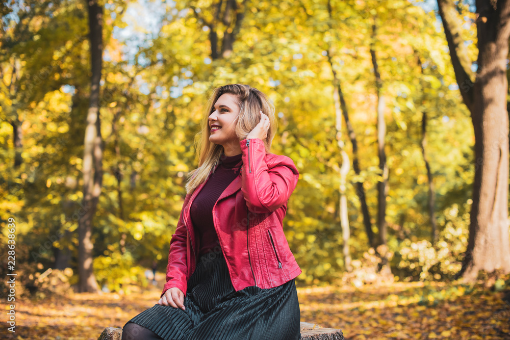 Happy smiling beautiful plus size model . Close up large girl smiling on a sunny day with good mood, Photo of new age standard of beauty, autumn time Happy smiling beautiful plus size model . Close up large girl smiling on a sunny day with good mood, Photo of new age standard of beauty, autumn time