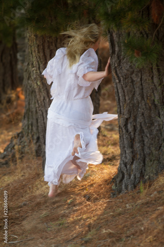 girl in white dress running away