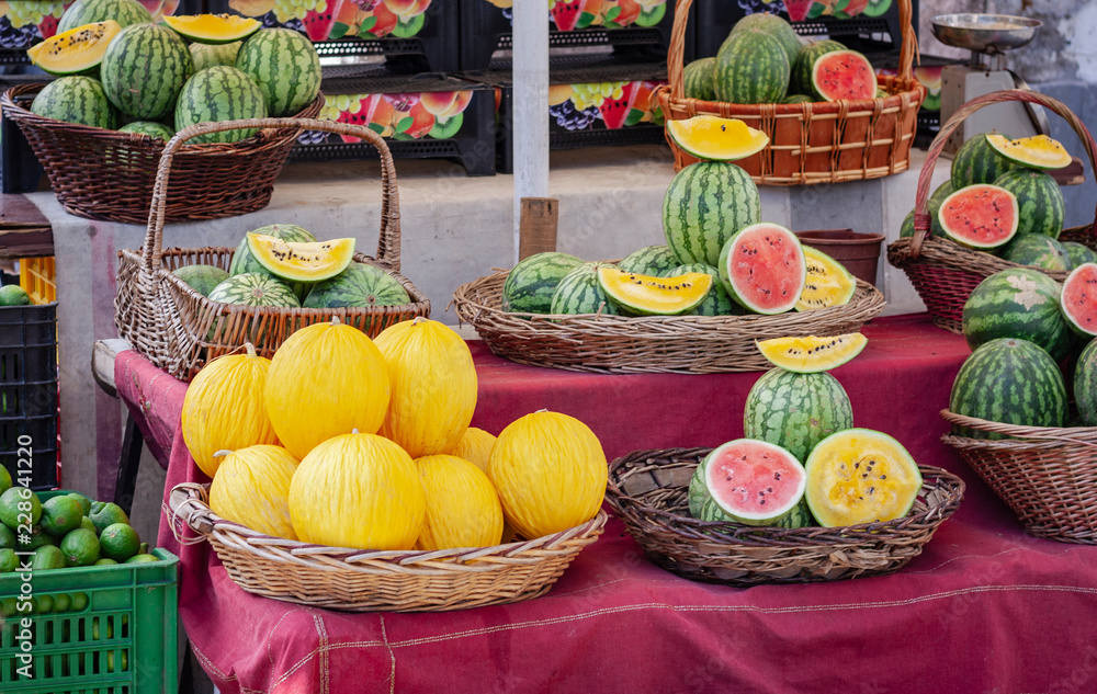 Ripe melons and watermelons in the fruit market, Catania, Sicily, Italy