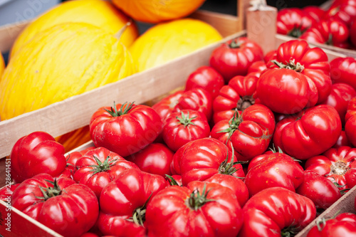 Ripe  tomatoes and melons in the fruit market, Catania, Sicily, Italy