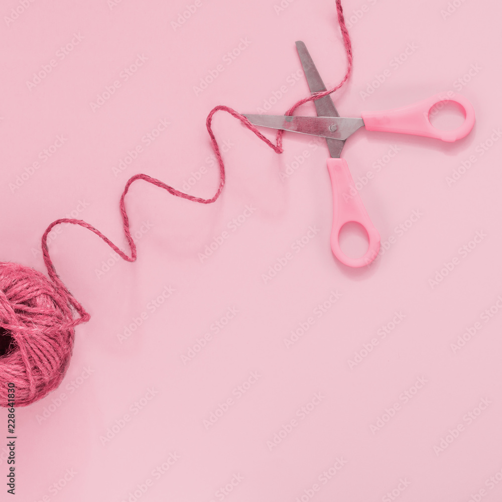Rosy scissors cut pink thread, pastel background, minimal, art, flatlay Concept - a break between actions, stop Rosy scissors cut pink thread, pastel background, minimal, art, flatlay Concept - a break between actions, stop