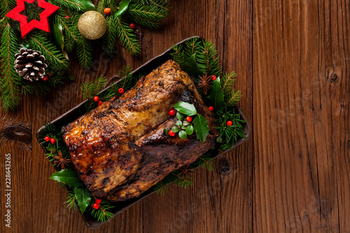 Roast pork loin with Christmas decoration.