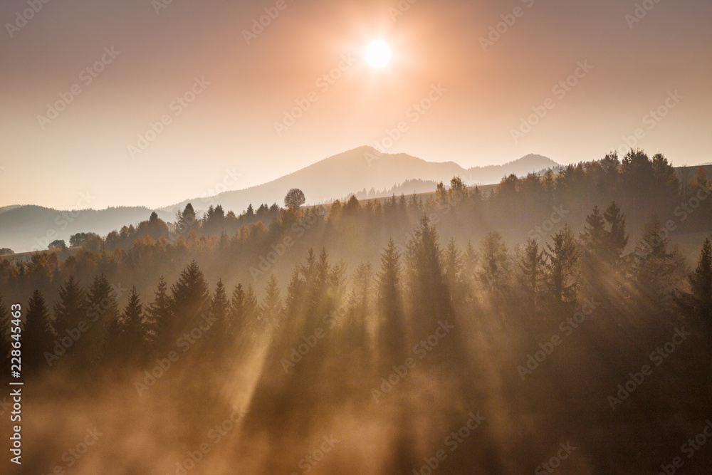 Fototapeta premium Autumn landscape, sunrise in a foggy morning in the region of Orava, Slovakia, Europe.