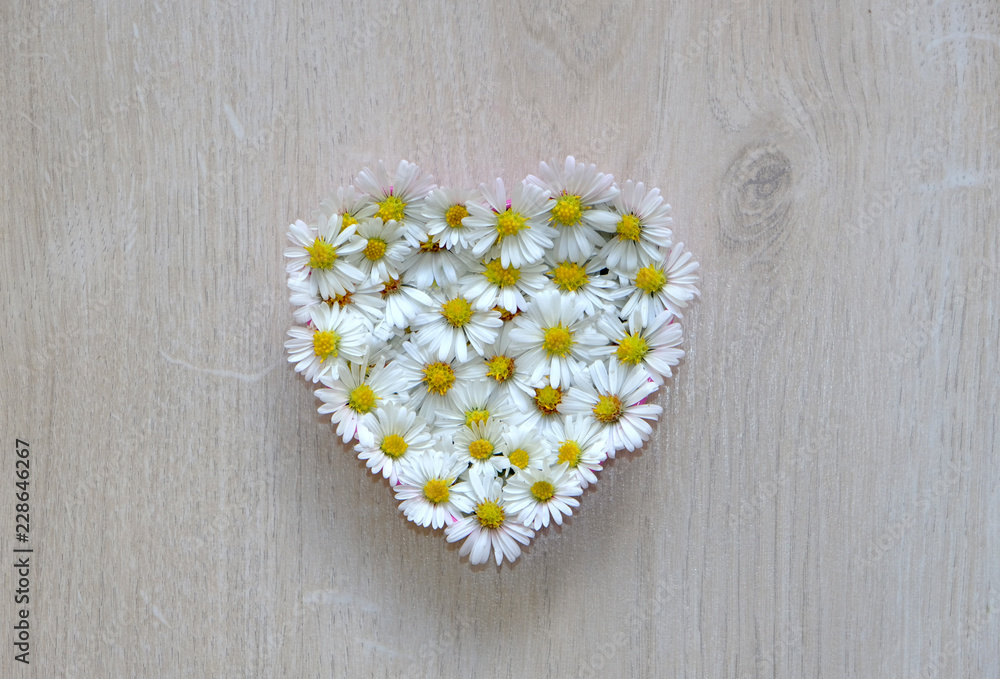 Obraz premium heart of flowers on wooden background, i love you, mothers day