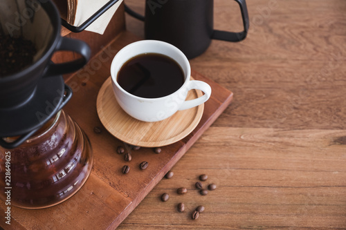 Top view image of drip coffee set on vintage wooden background