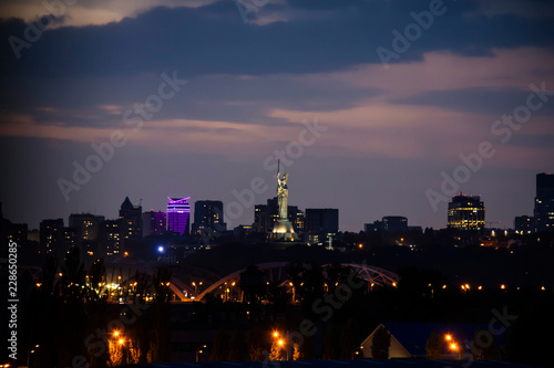 evening city of Kiev and the monument Motherland mother