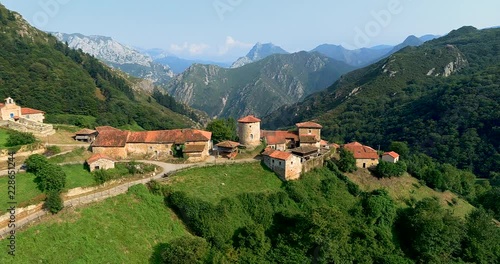 Wallpaper Mural Flying between the mountains with and old construction in front Torontodigital.ca