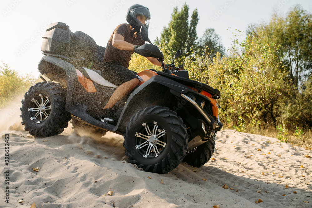 Atv freeriding in sand quarry, extreme sport Atv freeriding in sand quarry, extreme sport