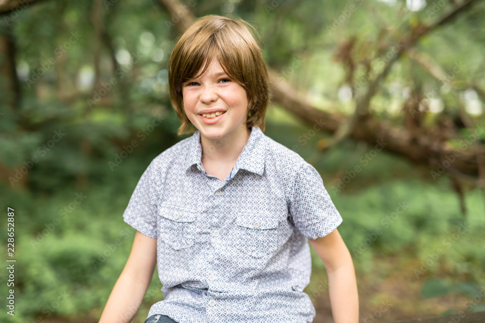 Portrait of a happy young boy outdoors forest Portrait of a happy young boy outdoors forest