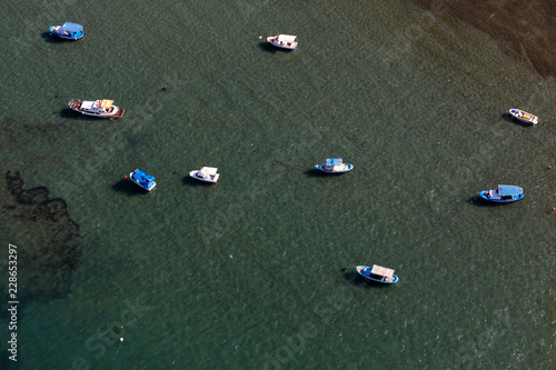 Fisher boats from top view over the sea.