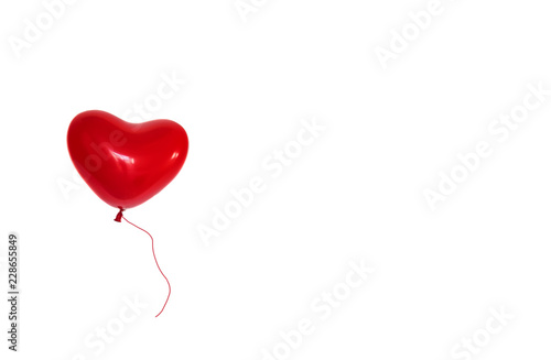 Bright red balloon heart shape isolated on a white background photo