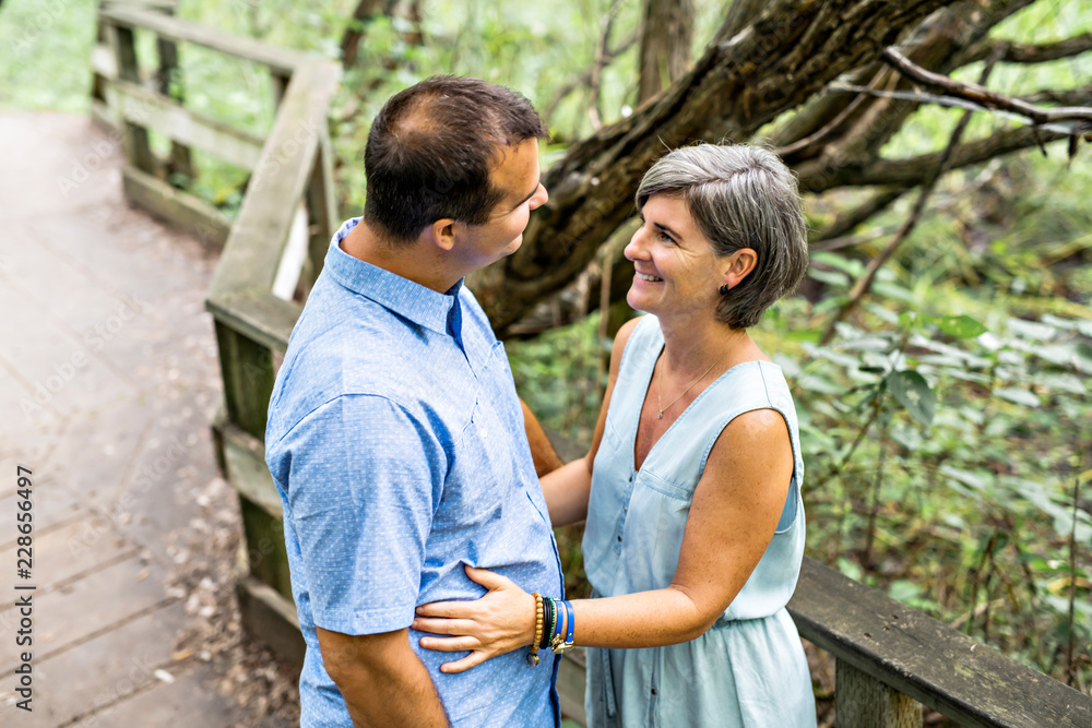 couple embracing each other having walk in the summer forest couple embracing each other having walk in the summer forest