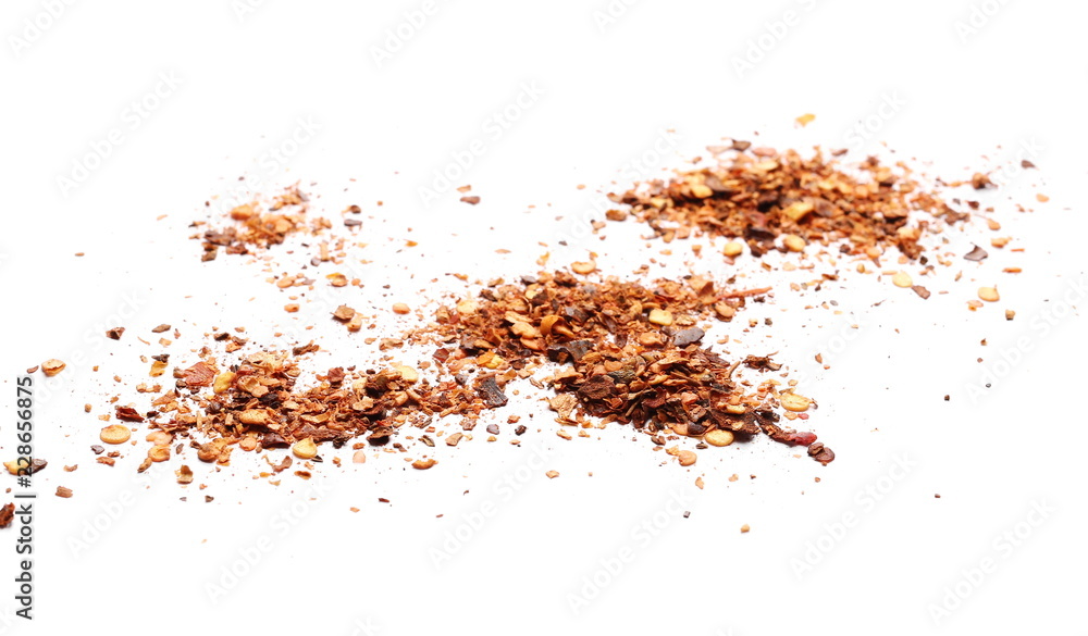 Crushed, ground red cayenne pepper, dried chili flakes and seeds isolated on white background Crushed, ground red cayenne pepper, dried chili flakes and seeds isolated on white background