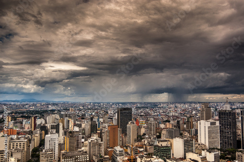 dramatic storm clouds over Sao Paulo skyline
