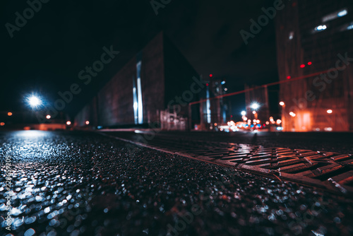 Bild auf Leinwand Wide-angle abstract shot from the ground of night cityscape with shallow depth o