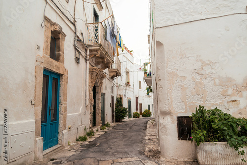 Little alley in the medieval white village of Ostuni at sunset © Sergio Pazzano