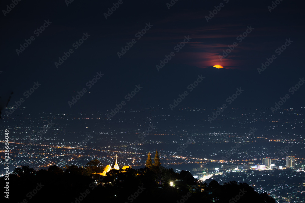 Naklejka premium Chiang Mai landscape and red full moon and clouds