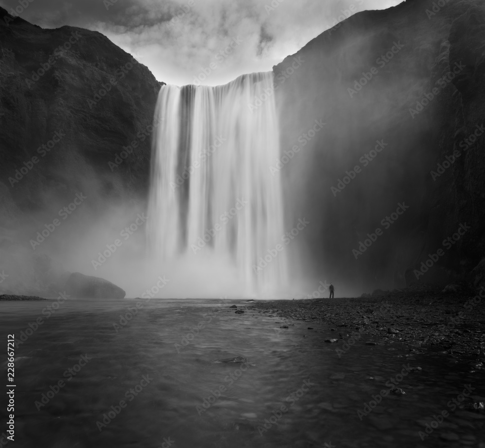 Iceland waterfall Skogafoss in Icelandic nature landscape. Famous tourist attractions and landmarks destination in Icelandic nature landscape on South Iceland. Iceland waterfall Skogafoss in Icelandic nature landscape. Famous tourist attractions and landmarks destination in Icelandic nature landscape on South Iceland.
