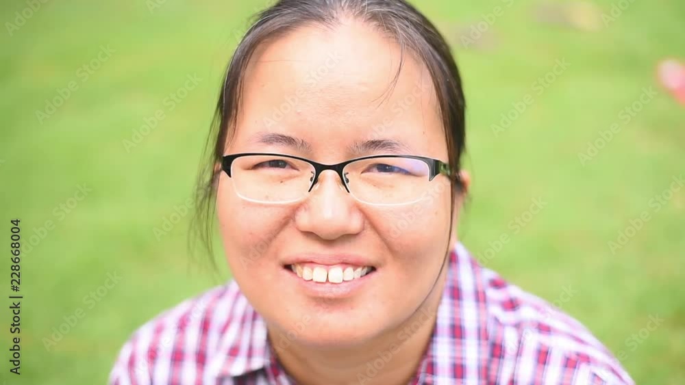 Smiling woman shows a happy expression. Smiling woman shows a happy expression.