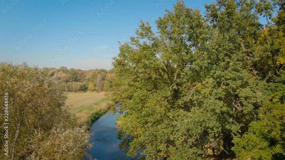 aerial view of a rural landscape with some trees and the meandering river aerial view of a rural landscape with some trees and the meandering river
