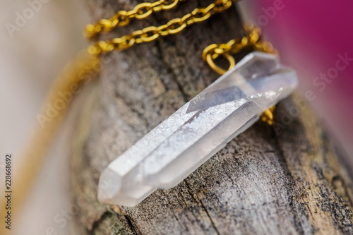 Wallpaper Mural Natural crystal quartz pendant on metal chain Torontodigital.ca