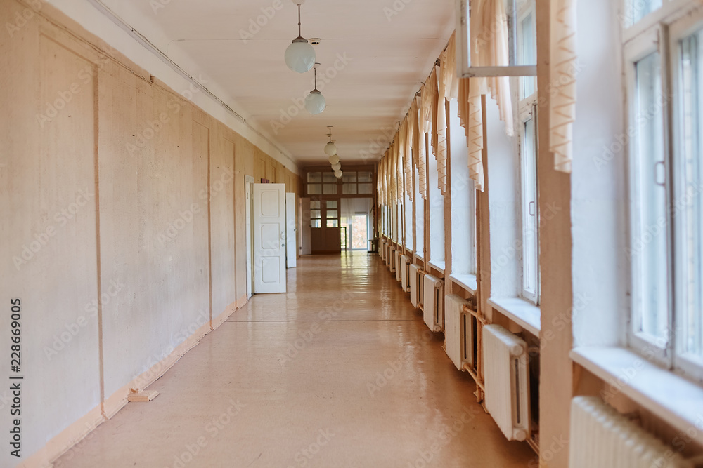 school, education and learning concept - empty school corridor